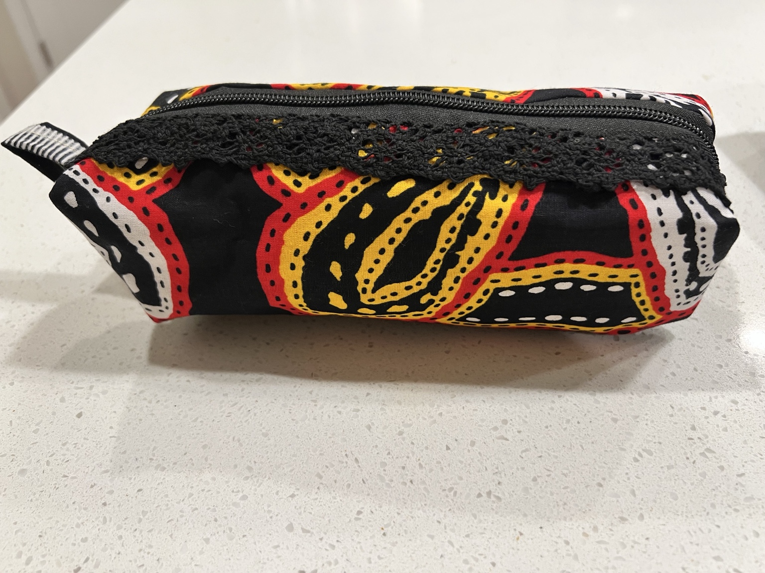 Red, yellow, black, and white Cameroon fabric pouch
